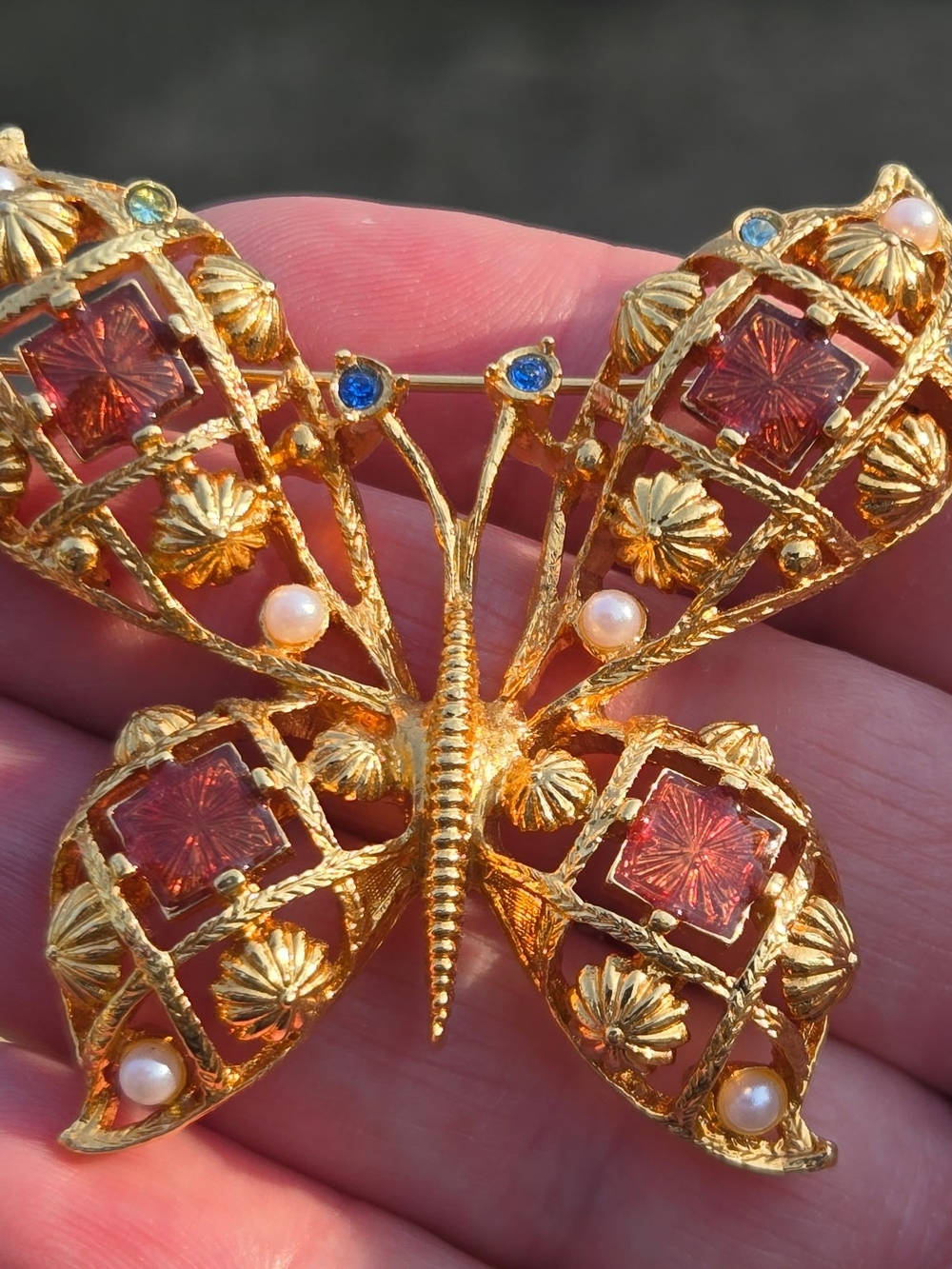 Vtg. gold toned metal, enamel faux pearl rhinestone butterfly brooch.